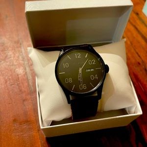 Gorgeous and masculine Nixon Sentry watch with dark brown band and black face.